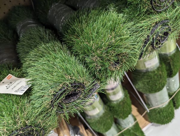 Rolls of artificial turf in a shop